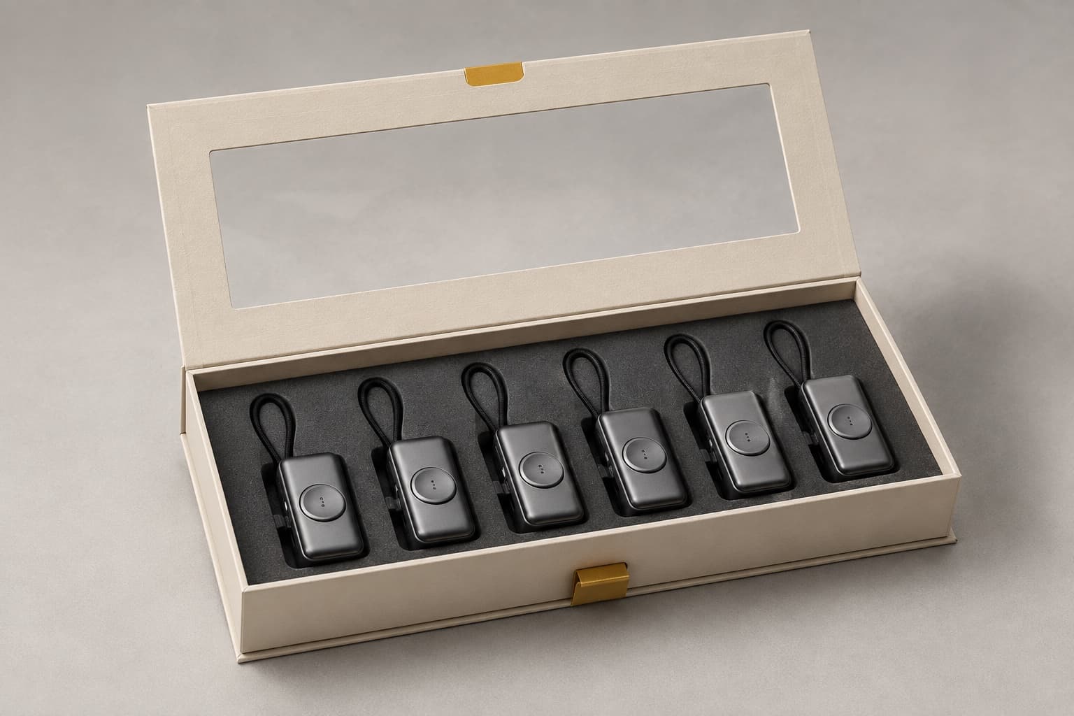 Mini power banks arranged in an open premium gift box with a transparent window